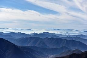 snowy mountains with clouds