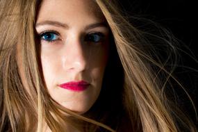 portrait of a girl with long hair and red lips