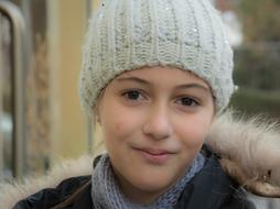 young girl in a hat