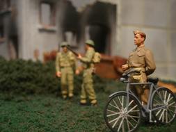 soldiers grass grass people bicycle