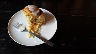 breakfast roll on a plate on the table.