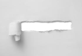 White, ripped, torn paper on the white wall, clipart