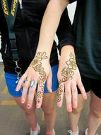 henna tattoos on the hands of girls