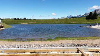 lake beach beach beautiful grassy view