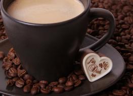 roasted coffee beans with a hot beverage