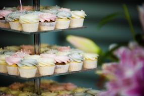 delicious cream cupcakes on a tray