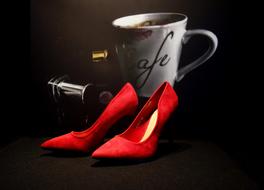 red shoes on the background of the mug