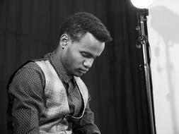 portrait of a black young man in a studio