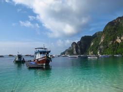 fishing boat on an island in the ocean