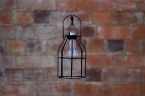 vintage lamp on brick wall background