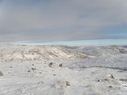 snowy wasteland with mountains