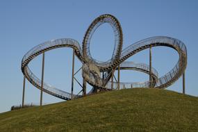 A swirling sculpture of amusement rides