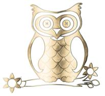 golden decoration in the form of an owl on a white background