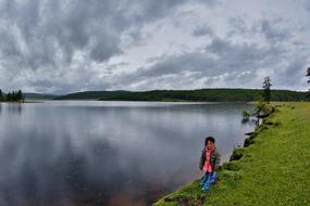 a man walking near the lake