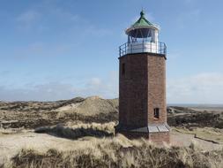 A brick lighthouse on the ground