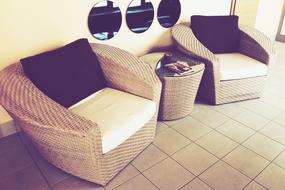 two wicker chairs and a coffee table