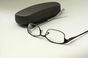 glasses with a case on the table