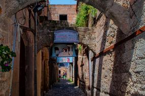 an arch with stone houses