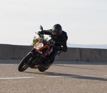 A man on a motorcycle speed show