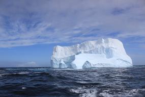 a large iceberg in the water