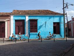 The blue house with people