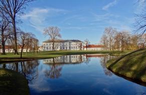 distant view of Neuhardenberg Palace in garden at pond, germany, Brandenburg