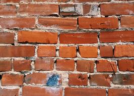 blue stain on a brick wall