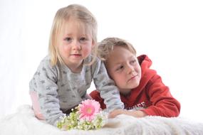 photo session of children with pink flowers