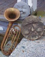 Sculpture Faces and Old trumpet