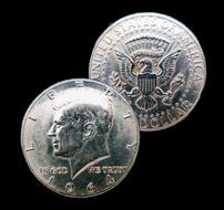 silver coins on a black background