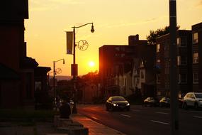 photo of cars on a city street in the evening