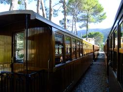 The old train carriage is standing