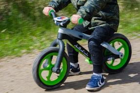 child riding a bike on the street