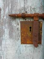 the door with a rusty lock
