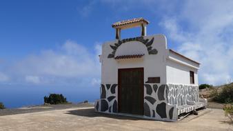 A small building in the mountains