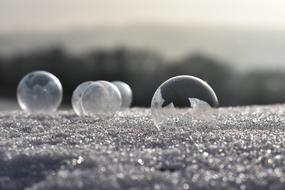bubbles frozen in white snow cold