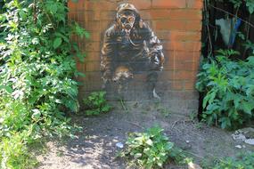 graffiti depicting a person in a gas mask