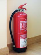 red fire extinguisher on the wall
