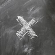 white cross in chalk on a gray background