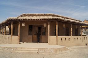 wooden house with a hay roof