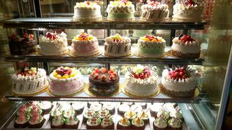 sale of cakes with cream and fruits