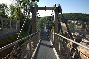 a bridge with a road leading into the distance