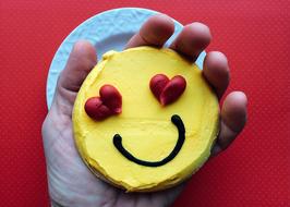 smiley face cake hand