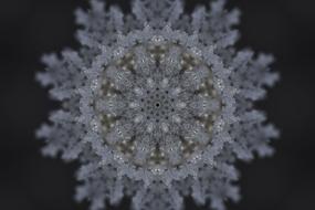 Close-up of the beautiful and colorful snowflake pattern, at black background, clipart