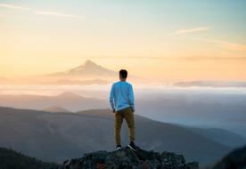 the white shirt with the man on the mountain.