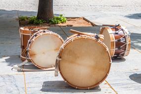 Drums Brown on the city pavement on a sunny day