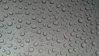 Close-up of the grey sunroof, with the water drops