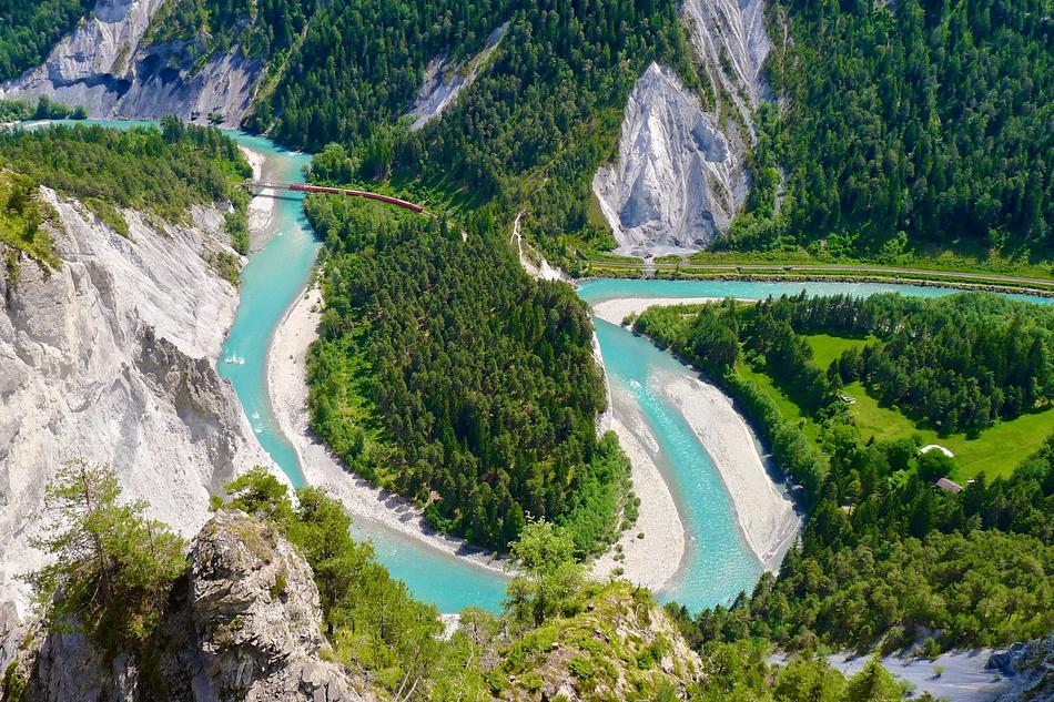 river in the mountains in the trees