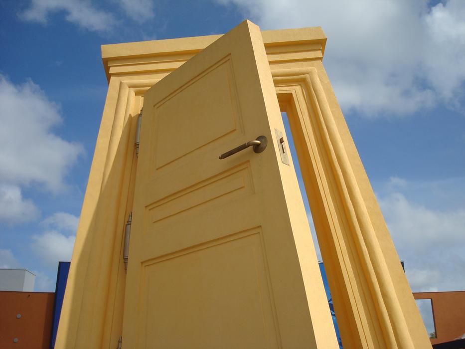 yellow door in a blue sky