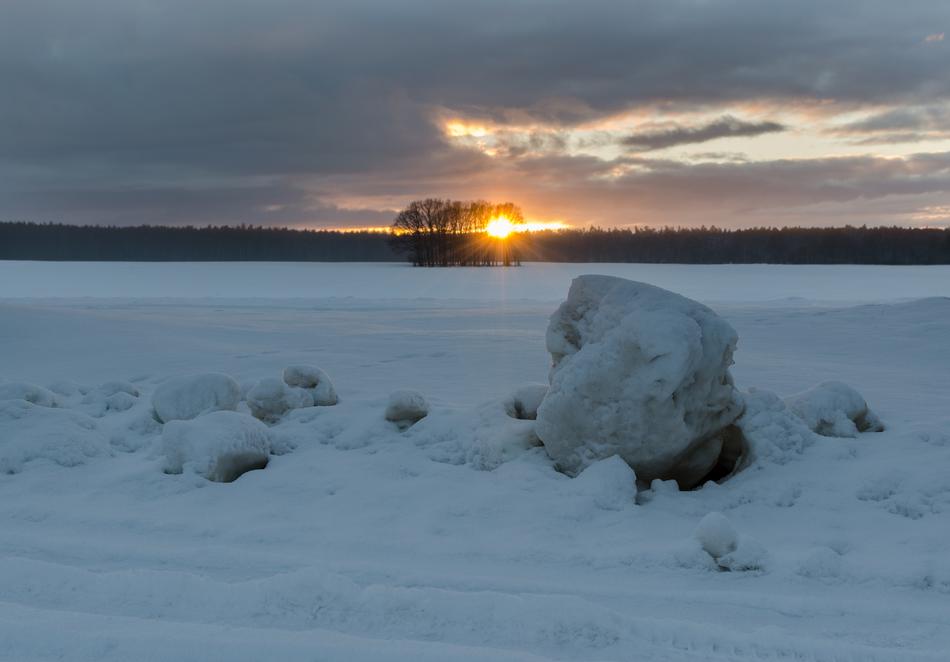 snowy ground with stone